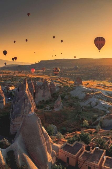 Hot air balloon tour at first light in Cappadocia - Tea, breakfast, and the launch field with hundreds of balloons inflating