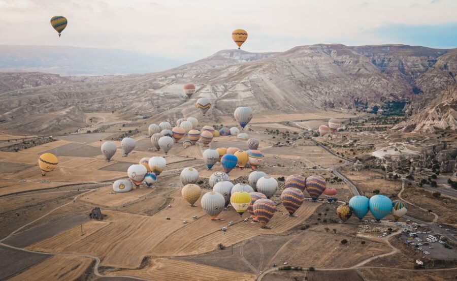Hot air balloons in Goreme red valley - Sunrise Hotel Pickup: Morning Logistics That Actually Matter