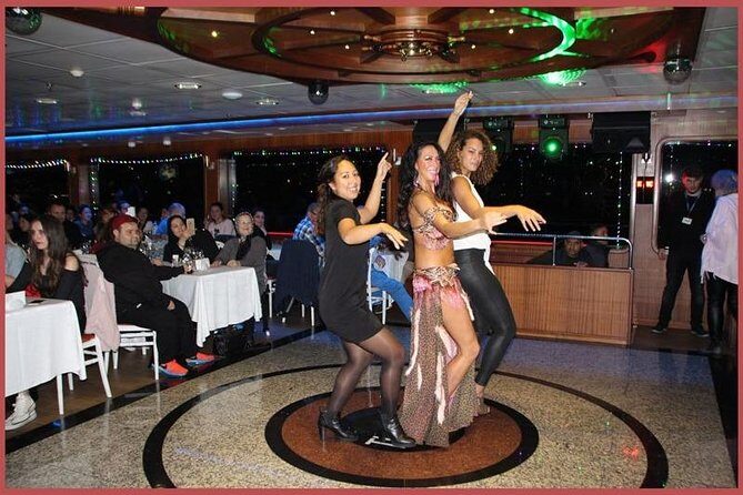 Istanbul Bosphorus Cruise with Dinner and Belly-Dancing Show - Dolmabahçe Palace: the palace exterior that works best in the dark