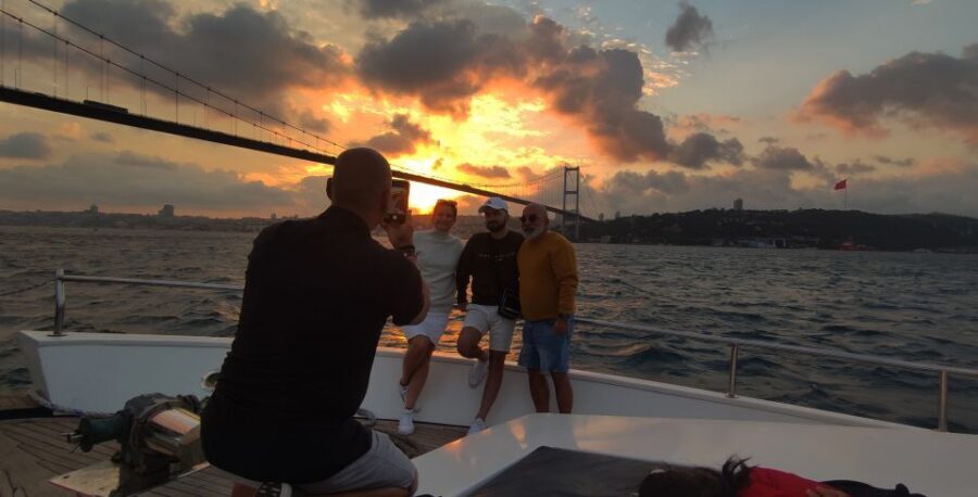 Istanbul: Bosphorus Sunset Cruise with Snacks and Wine - First light at Dolmabahçe Palace and the stretch toward Besiktas