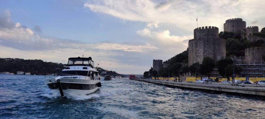 Istanbul: Bosphorus Sunset Cruise with Snacks and Wine - Rumeli Fortress, Fatih Sultan Mehmet Bridge, and the Asian shoreline