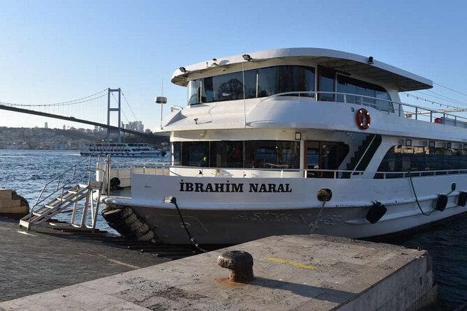 Sunset Cruise with Stop along Asia: Discover Istanbul's Bosphorus - Dolmabahçe from the water: Mosque, Palace, and the big Ottoman wow-factor