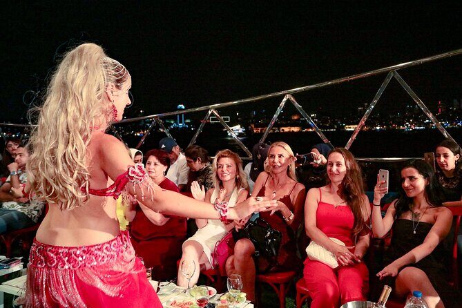 Turkish Night Tour on the Bosphorus w/Private table and pick-up - Ortaköy Beach at night: food, souvenirs, and the bridge in view